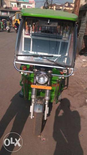 Green And Black Electric Auto Rickshaw