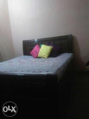 Queen size wooden bed in very good condition