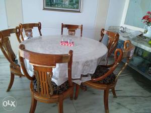 Round White Table And Six Brown Wooden Chairs Dining Set