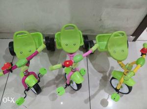 Toddler's Three Green Trikes