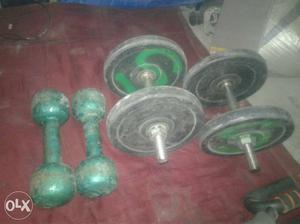 Two To Black Adjustable And Two Green Fixed Dumbbells