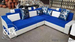 Blue And White Fabric Corner Sofa With Throw Pillows