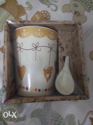 Brown And White Ceramic Mug With Spoon