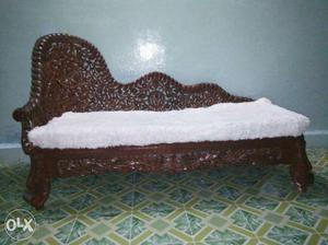 Brown Wooden Chaise Lounge With White Cushion