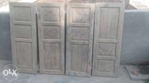 Four Brown Wooden Cabinet Doors