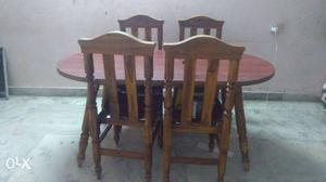 Oblong Brown Wooden Table With Four Chairs Set