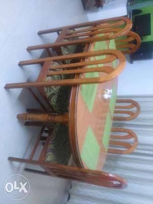 Teak wood dining table and chairs with raymonds