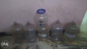 5 water tins along with water dispenser