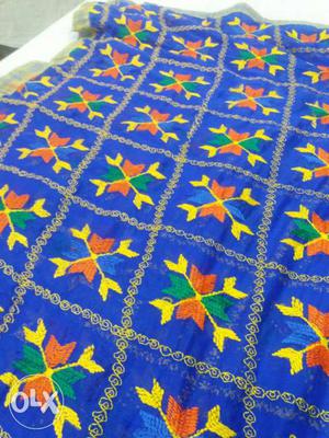 Blue, Yellow, And Orange Floral Textile
