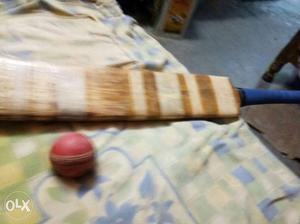 Brown And Blue Wooden Paddle Stick
