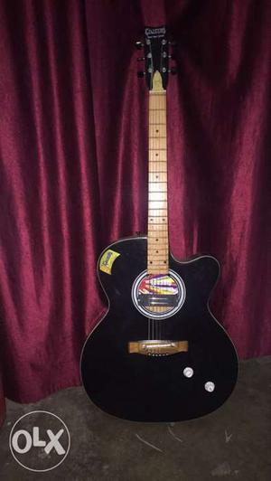 Givson guitar with cover and an extra oair of