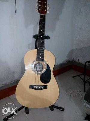 It is a junior acoustic guitar of Granada company