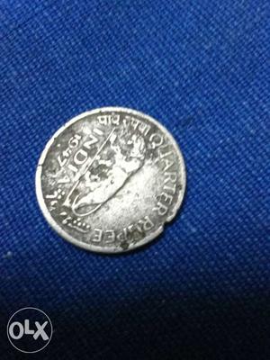 Old silver quarter rupee coin