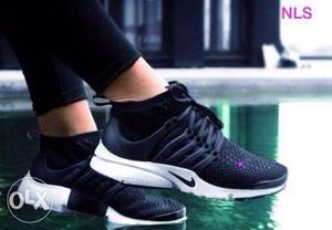 Pair Of Black And White Nike Low-top Sneakers