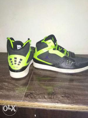Pair Of Black-and-green Nike Air Jordan Basketball Shoes