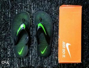 Pair Of Green Nike Flipflops