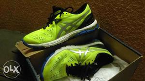 Pair Of Neon-green And White ASICS Sneakers In Box