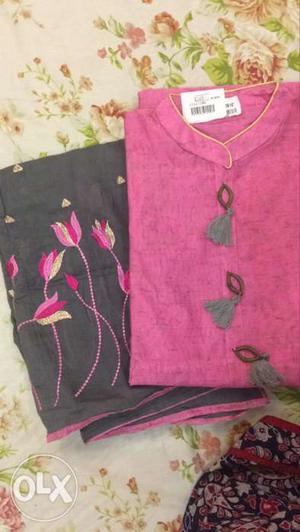 Pink And Black Floral Textiles