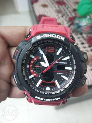Round Black And Red Casio G-Shock Watch With Red Band