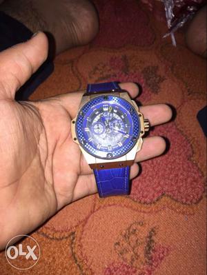 Round Silver-colored And Blue Chronograph Watch With Blue