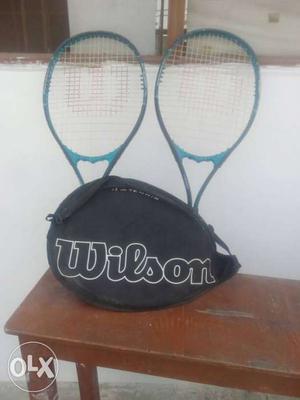 Two Blue-and-black Wilson Lawn Tennis Rackets