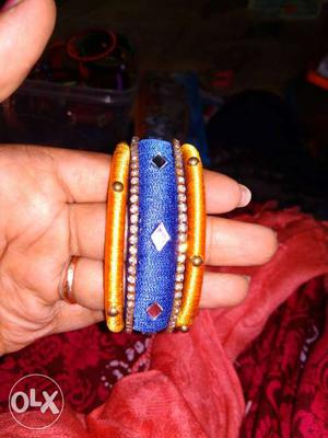 Two Orange And One Blue Silk Thread Bangles