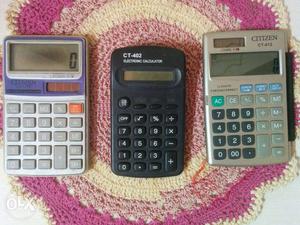 3 calculators with different features one is