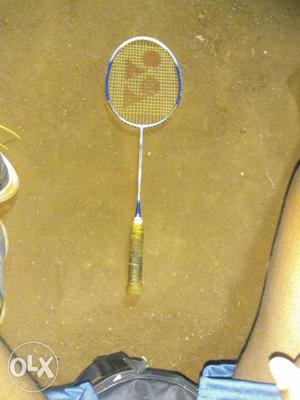 Blue, White, And Yellow Yonex Badminton Racket