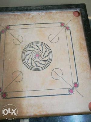 Carrom board with coinsand striker