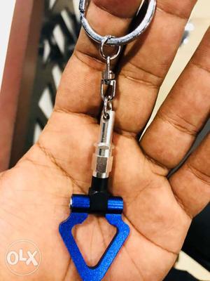 Silver-colored And Blue Keychain