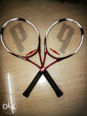 Two Black-white-and-red Tennis Rackets