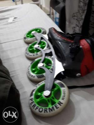 Unpaired Black And Green Roller Blade