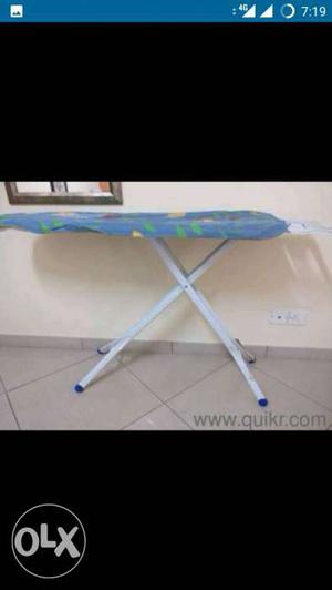 White And Blue Ironing Board