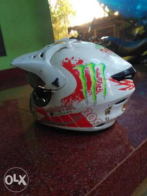 White, Red And Green Motocross Helmet