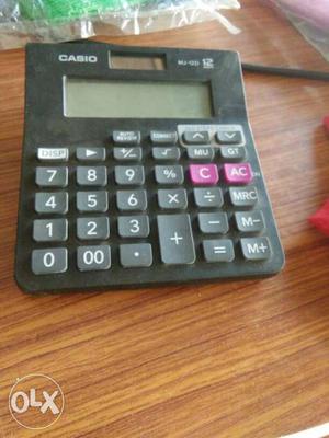 Black And Gray Casio Electronic Calculator