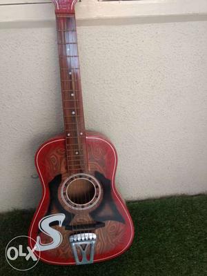 Red And Black Wooden Guitar