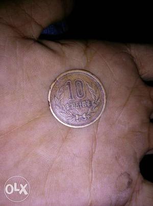 Round Cooper-colored 10 Coin