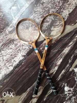 Two Brown wooden ball Badminton Rackets