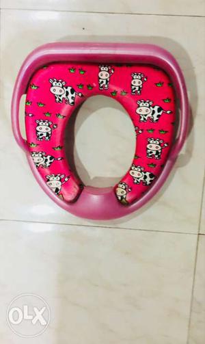 Baby's Pink And Red Potty Trainer