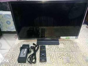 Black Flat Screen TV With Remote