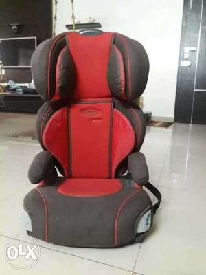 Booster car seat with cup/bottle holders and detachable back