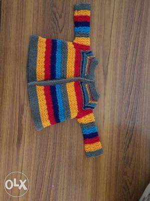 Hand knitted sweater for new born.