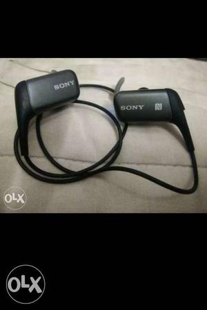 Pair Of Black Sony Wireless Earphones