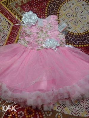 Pink frock with price tag ₹ 590