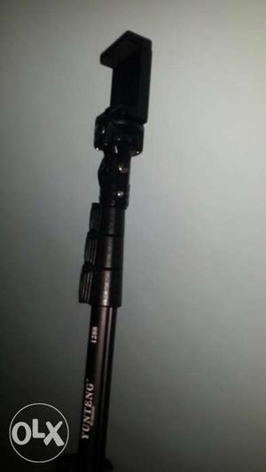 Selfie stick unused condition and a headphone