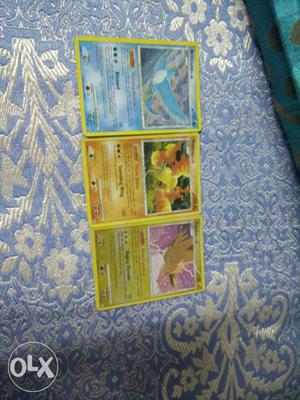 Three Pokemon Trading Game Cards