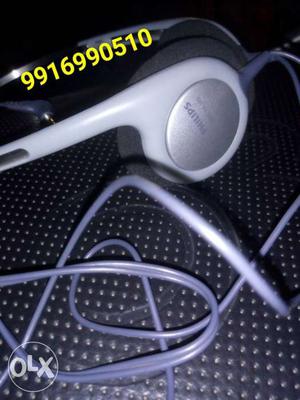 White And Silver Philips Headphones