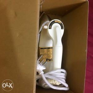Beige Clothes Iron With Brown Box