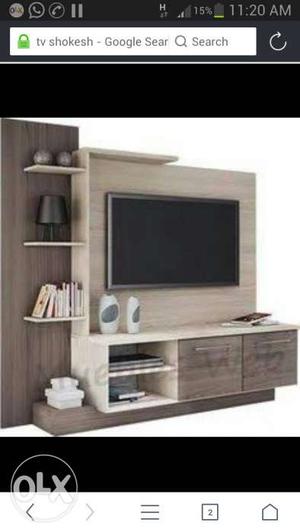 Black Flat Screen TV And Brown Wooden Entertainment Center