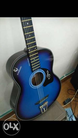 Blue and black acoustic guitar, amazing looks and